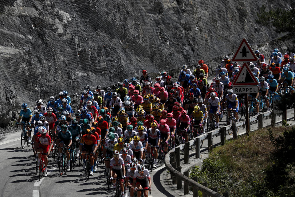 The pack rides during the second stage of the Tour de France cycling race over 186 kilometers (115,6 miles) with start and finish in Nice, southern France, Sunday, Aug. 30, 2020. (AP Photo/Thibault Camus)