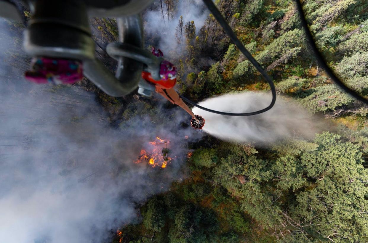 <span class="caption">A helicopter drops water on a forest fire in Alaska.</span> <span class="attribution"><a class="link " href="https://www.flickr.com/photos/thenationalguard/48233324007/" rel="nofollow noopener" target="_blank" data-ylk="slk:Michael Risinger/U.S. Army National Guard;elm:context_link;itc:0;sec:content-canvas">Michael Risinger/U.S. Army National Guard</a>, <a class="link " href="http://creativecommons.org/licenses/by/4.0/" rel="nofollow noopener" target="_blank" data-ylk="slk:CC BY;elm:context_link;itc:0;sec:content-canvas">CC BY</a></span>