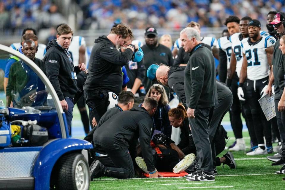 Carolina Panthers guard Chandler Zavala is tended to after being injured in the first half of an NFL football game against the Detroit Lions in Detroit, Sunday, Oct. 8, 2023. (AP Photo/Paul Sancya)