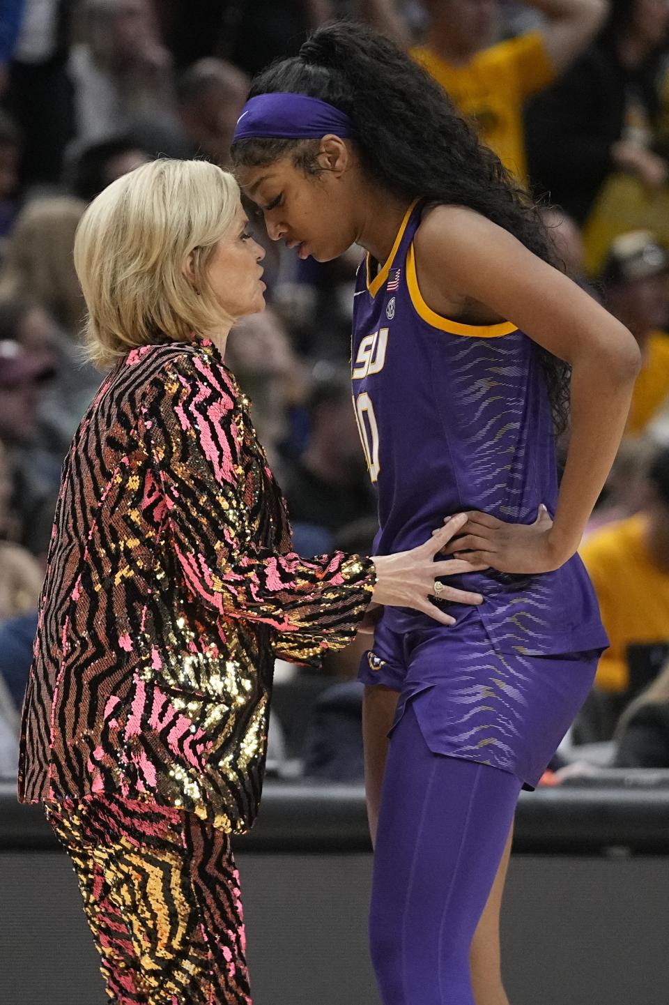 LSU head coach Kim Mulkey talks to Angel Reese during the second half of the NCAA Women's Final Four championship basketball game against Iowa Sunday, April 2, 2023, in Dallas. (AP Photo/Darron Cummings)