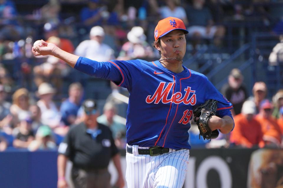 New York Mets pitcher Shintaro Fujinami (19) throws over to first base in the seventh inning against the Detroit Tigers at Clover Park on March 10, 2024, in Port St. Lucie, Fla.