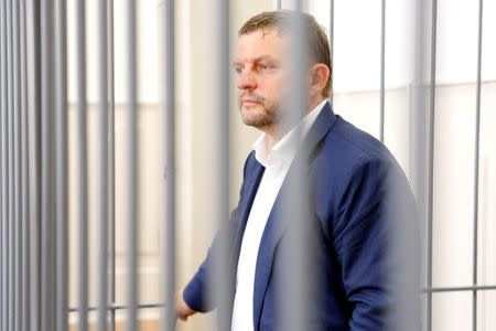 Governor of Kirov region Nikita Belykh, who is accused by the Investigative Committee of taking a bribe, stands inside a defendants' cage during a hearing at the Basmanny district court in Moscow, Russia, June 25, 2016. REUTERS/Maxim Zmeyev