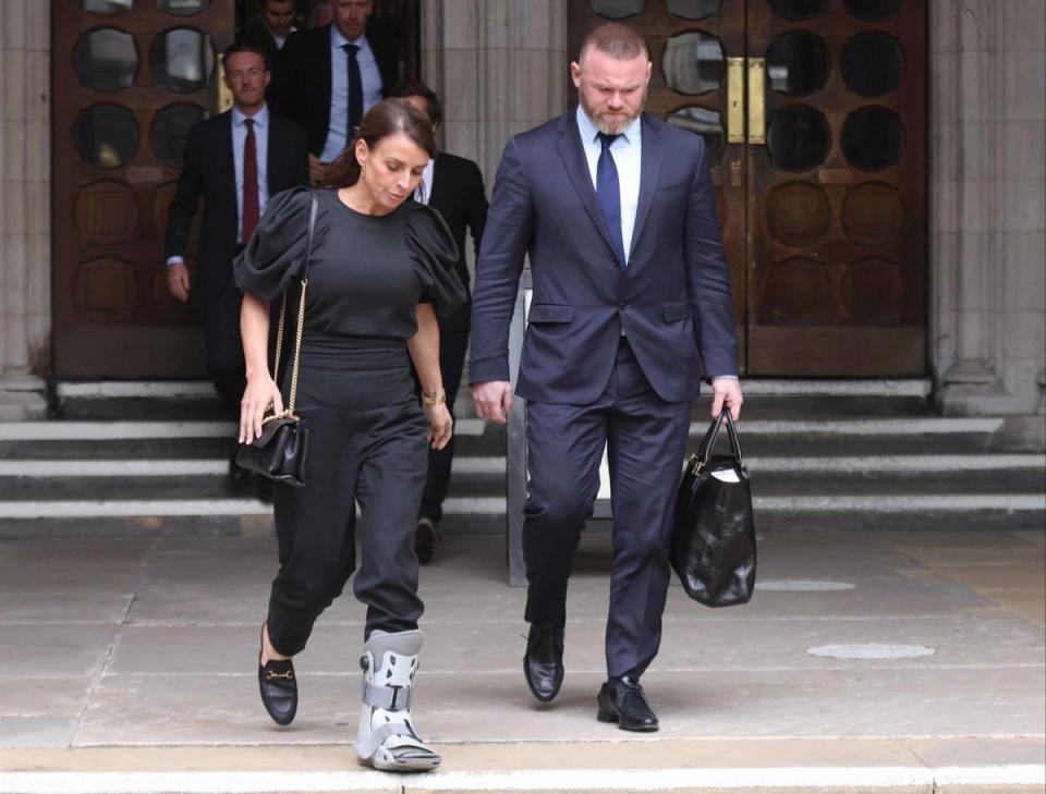 Coleen and Wayne Rooney leave the Royal Courts Of Justice (PA)