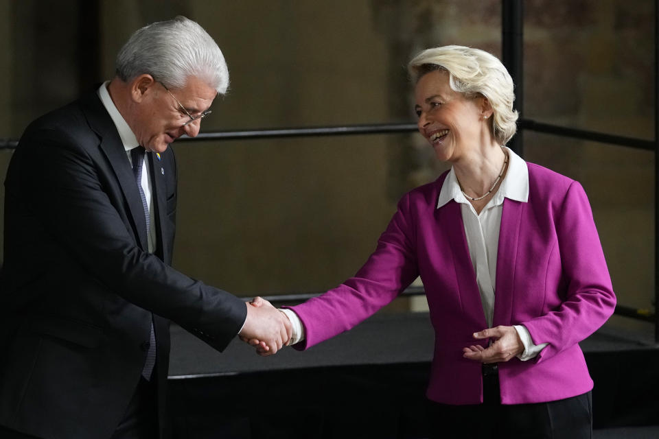 European Commission President Ursula von der Leyen, right, shakes hands with Chair of the Presidency of Bosnia and Herzegovina Sefik Dzaferovic after a group photo during meeting of the European Political Community at Prague Castle in Prague, Czech Republic, Thursday, Oct 6, 2022. Leaders from around 44 countries are gathering Thursday to launch a "European Political Community" aimed at boosting security and economic prosperity across the continent, with Russia the one major European power not invited. (AP Photo/Petr David Josek)