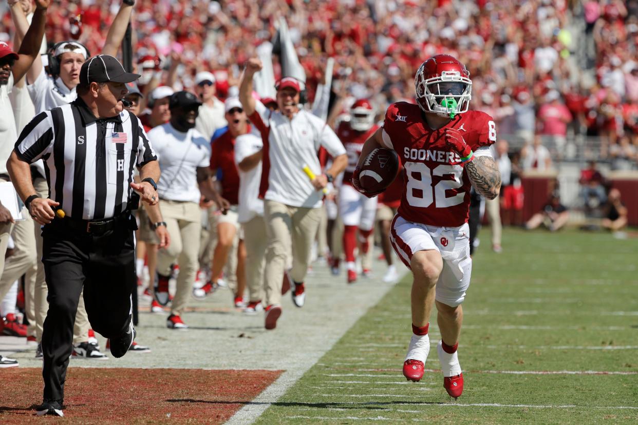 Oklahoma's Gavin Freeman (82) runs back a punt for a touchdown during a college football game between the University of Oklahoma Sooners (OU) and the Arkansas State Red Wolves at Gaylord Family-Oklahoma Memorial Stadium in Norman, Okla., Saturday, Sept. 2, 2023.