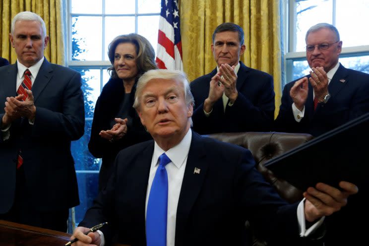 President Trump signed addition executive orders in the Oval Office on Saturday. (Photo: Jonathan Ernst/Reuters)