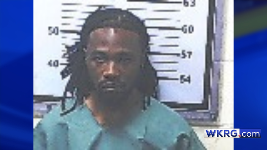 Mugshot of Adrian Jamal Dixon on a blue background with the WKRG.com logo