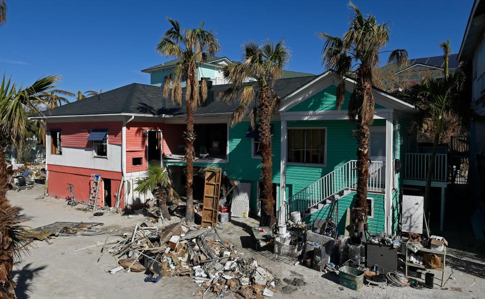 While daily cleanup continues nearly one month after Hurricane Ian's destruction on Fort Myers Beach's Estero Island, some buildings, boats and homes still look the same the day after landfall.