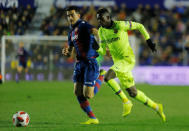 Soccer Football - Copa del Rey - Round of 16 - First Leg - Levante v FC Barcelona - Ciutat de Valencia, Valencia, Spain - January 10, 2019 Levante's Sergio Postigo in action with Barcelona's Ousmane Dembele REUTERS/Heino Kalis