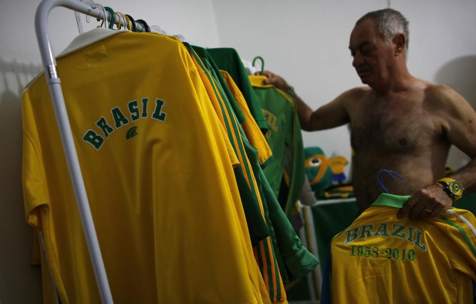 Brazilian attorney, Nelson Paviotti, gets dressed in one of his many outfits with the colors of the national flag in Campinas