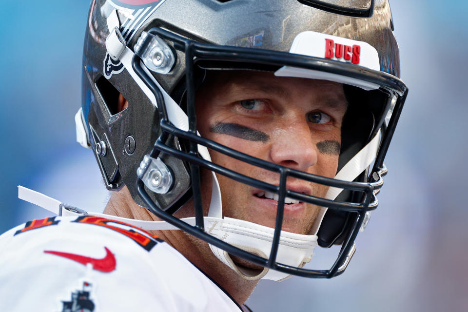 CHARLOTTE, NORTH CAROLINA - DECEMBER 26: Tom Brady #12 of the Tampa Bay Buccaneers on the sidelines during the fourth quarter in the game against the Carolina Panthers at Bank of America Stadium on December 26, 2021 in Charlotte, North Carolina. (Photo by Jared C. Tilton/Getty Images)