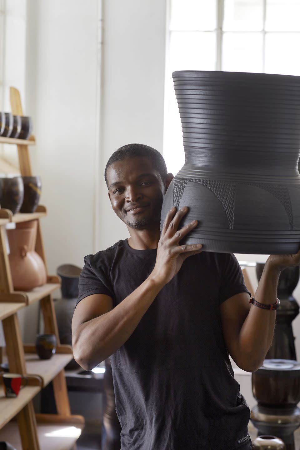 a man holding a vase