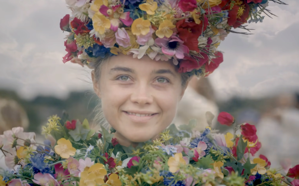 woman smiling covered in flowers