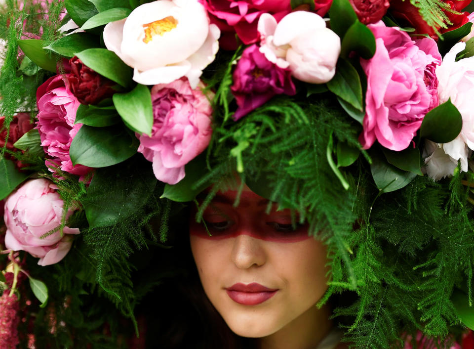 A model wears a floral headdress at Chelsea Flower show