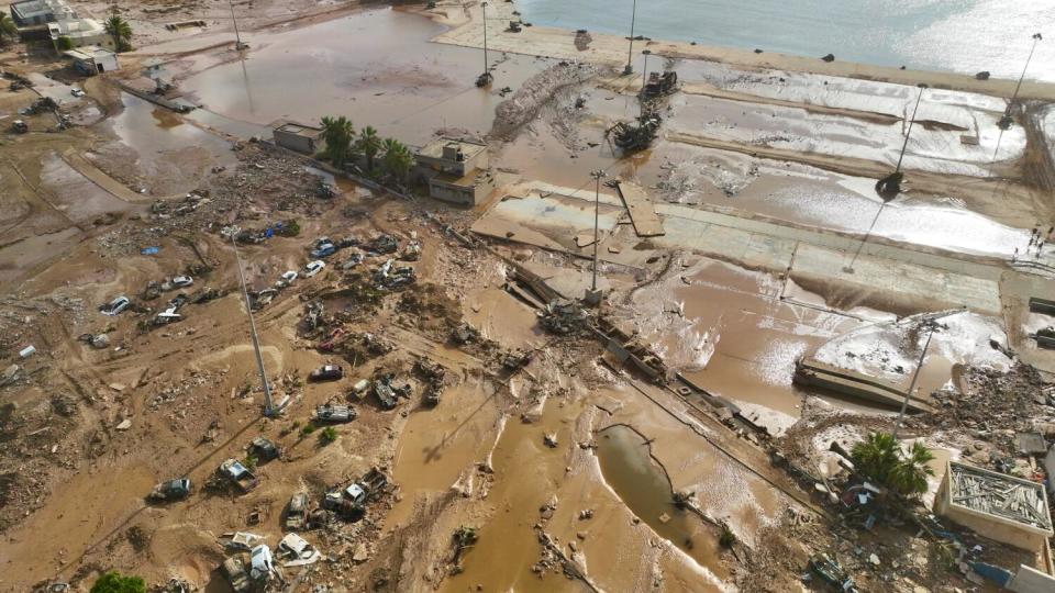 Mud covers a neighborhood in the coastal town of Derna, Libya, in an aerial view.