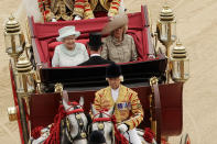 The Queen travelled in a 1902 State Landau with her eldest son Prince Charles and wife Camilla. Thousands of wellwishers from around the world have flocked to the capital to witness the spectacle of the Diamond Jubilee celebrations.