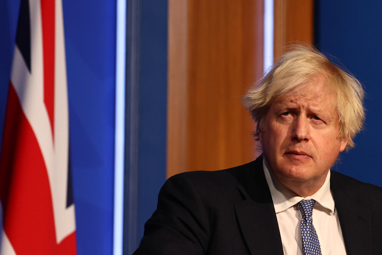 LONDON, ENGLAND - DECEMBER 08: British prime Minister Boris Johnson gives a press conference at 10 Downing Street on December 8, 2021 in London, England. During the press conference, the Prime Minister announced that the government will implement its “Plan B” due to the rapid transmission of the Omicron variant. The work from home guidance has been reintroduced, mask wearing at public indoor venues will be enforced and mandatory COVID-19 vaccination passports will be required for entrance into crowded venues such as nightclubs. (Photo by Adrian Dennis-WPA Pool/Getty Images)