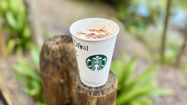 Caramel Apple drink on fence