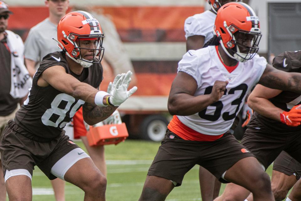 Cedric Tillman (89), left, and Lonnie Phelps (63), right, run a drill during Browns rookie minicamp in Berea, Friday, May 12, 2023.