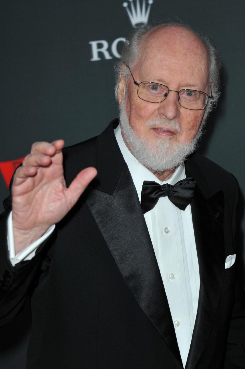 FILE - In this Sept. 27, 2012 file photo, composer John Williams arrives at the Los Angeles Philharmonic's 2012 Opening Night Gala, in Los Angeles. The film academy announced Thursday, Feb. 13, 2014, it plans to present a live Oscar Concert celebrating the year’s nominated composers, including Williams for "The Book Thief." Besides music from “Gravity,” “The Book Thief,” “Saving Mr. Banks,” “Philomena” and “Her,” the program will include performances of the four original songs up for Oscars this year. (Photo by Richard Shotwell/Invision/AP, file)