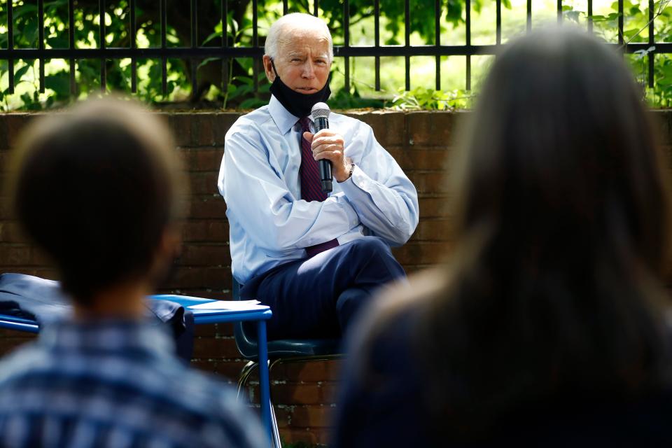 Democratic presidential candidate, former Vice President Joe Biden, center, speaks to Stacie Ritter, right, and her son, Jan, during a meeting with families who have benefited from the Affordable Care Act, Thursday, June 25, 2020, in Lancaster, Pa. (AP Photo/Matt Slocum)