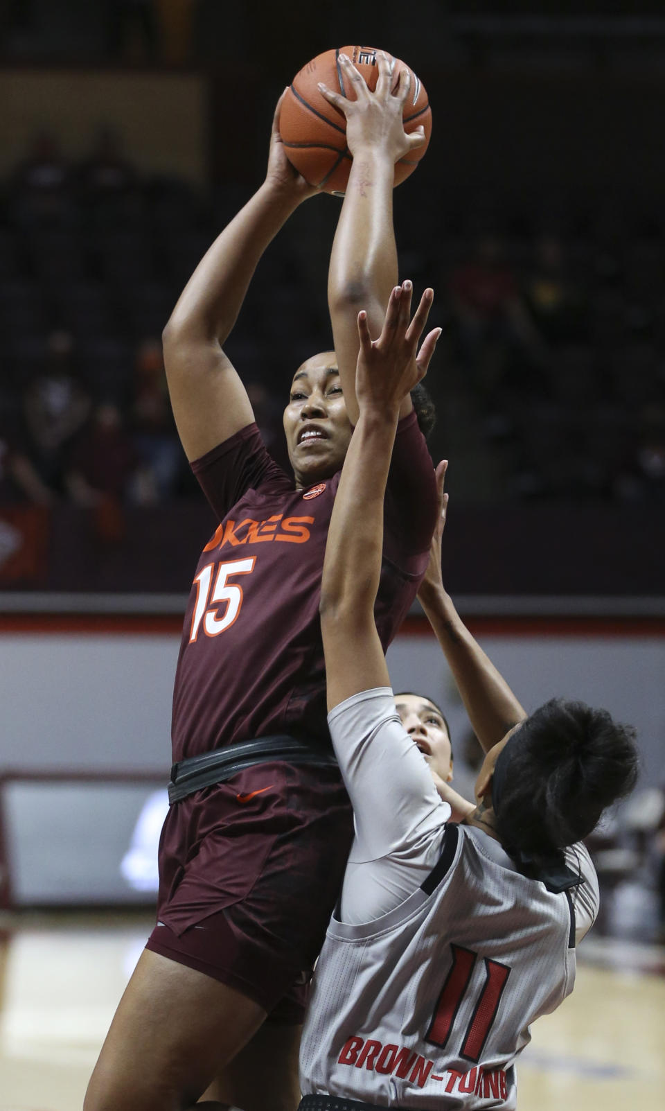 Virginia Tech's Azana Baines (15) grabs an offensive rebound in front of North Carolina State's Jakia Brown-Turner (11) during the first half of an NCAA college basketball game in Blacksburg, Va., Thursday, Jan. 28, 2021. (Matt Gentry/The Roanoke Times via AP, Pool)