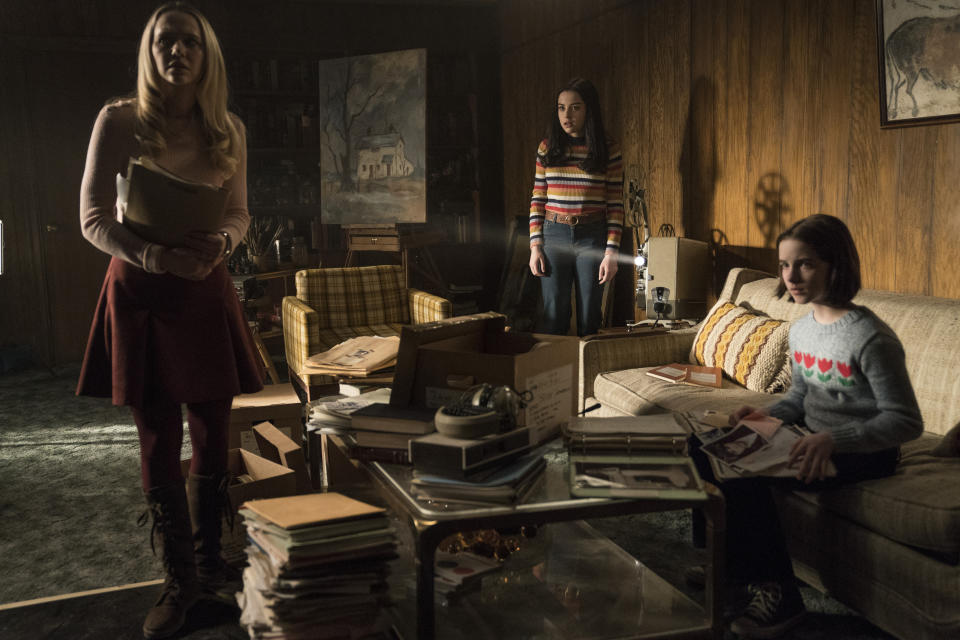 This image released by Warner Bros. Pictures shows Madison Iseman, from left, Katie Sarife and McKenna Grace in a scene from the horror film, "Annabelle Comes Home." (Dan McFadden/Warner Bros. Pictures via AP)