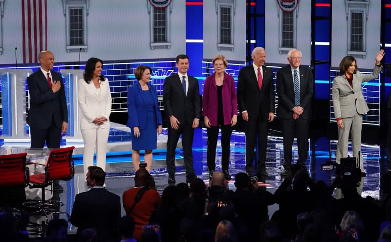 Democratic U.S. presidential candidates pose at the start of their fifth 2020 campaign debate at the Tyler Perry Studios in Atlanta