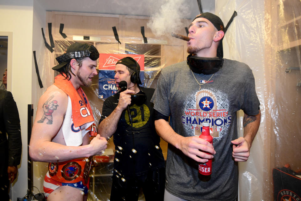 <p>Josh Reddick #22 of the Houston Astros (L) celebrates in the clubhouse with teammates after defeating the Los Angeles Dodgers 5-1 in game seven to win the 2017 World Series at Dodger Stadium on November 1, 2017 in Los Angeles, California. (Photo by Harry How/Getty Images) </p>