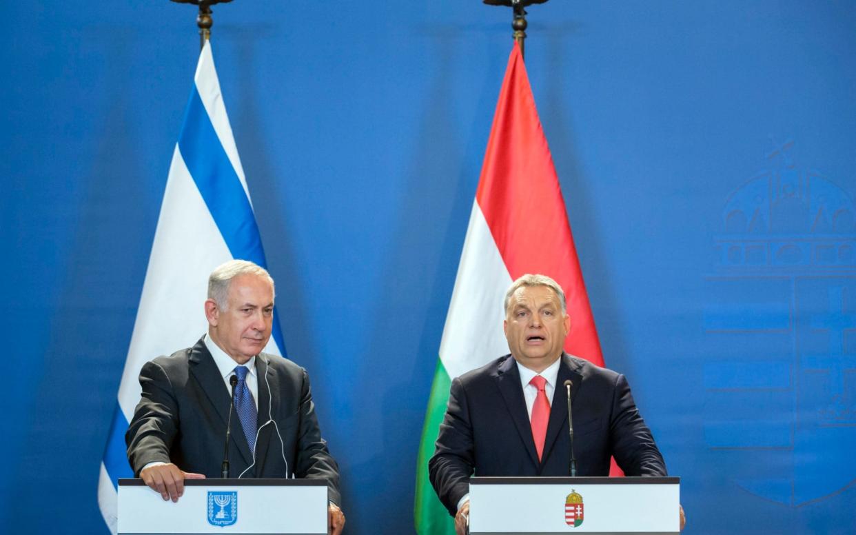 Israeli Prime Minister Benjamin Netanyahu, left, listens to his Hungarian counterpart Viktor Orban during their joint press conference - MTI