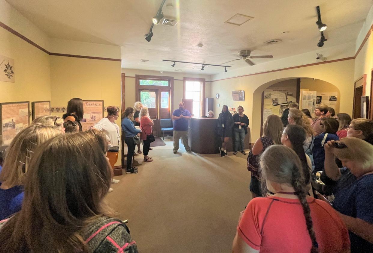 Teachers listen as a tour guide talks about Richard F. Pettigrew's historic home and museum in Sioux Falls as part of a South Dakota Department of Education History Road Trip in East River South Dakota on Monday, July 17, 2023. Pettigrew was the first U.S. Senator from South Dakota.