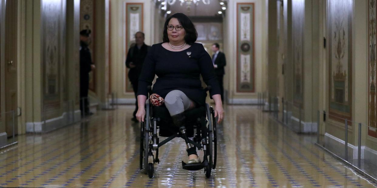Senator Tammy Duckworth moves through the halls of the US Senate.
