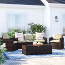 <p><strong>Sol 72 Outdoor</strong></p><p>wayfair.com</p><p><strong>$739.99</strong></p><p>The quintessential patio furniture set, this wicker seating group features a three-person sofa, two chairs and and a large table with storage. It comes with seat and back cushions that are made of a quick-drying foam with open pores, allowing water and air to flow through easily, and an antibacterial treatment to prevent mold and mildew so you don't have to worry about leaving them out in the rain. </p>