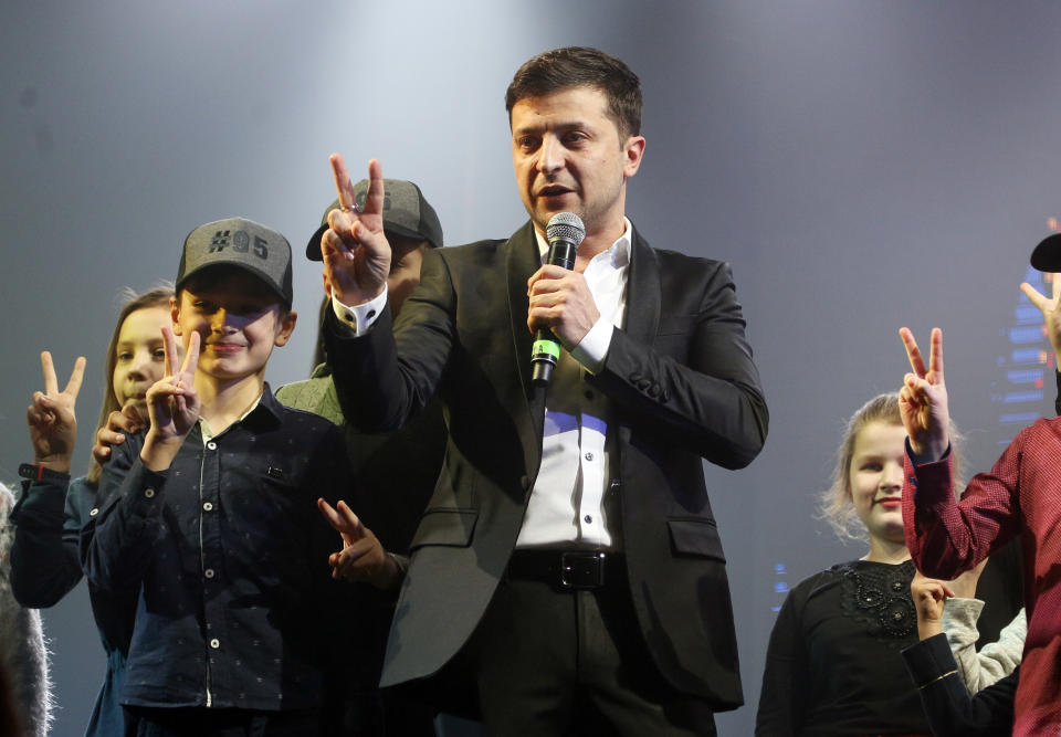 FILE - In this Friday, March 29, 2019 file photo, Volodymyr Zelenskiy, Ukrainian actor and candidate in the upcoming presidential election, hosts a comedy show at a concert hall in Brovary, Ukraine. Ukraine’s presidential runoff on Sunday, April 21, is a battle between a billionaire tycoon who rode anti-Russian protests to the nation’s top office five years ago, and a comedian who plays a president in a TV sitcom. The actor has used humor and social media to take pole position. (AP Photo/Efrem Lukatsky, file)