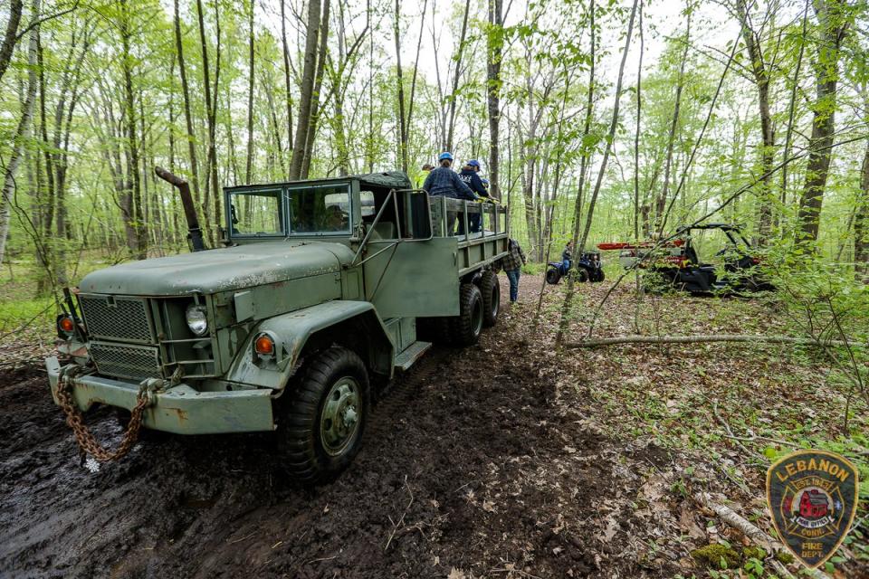 A cargo vehicle was used to ferry across equipment into the muddy woods (LVFD)