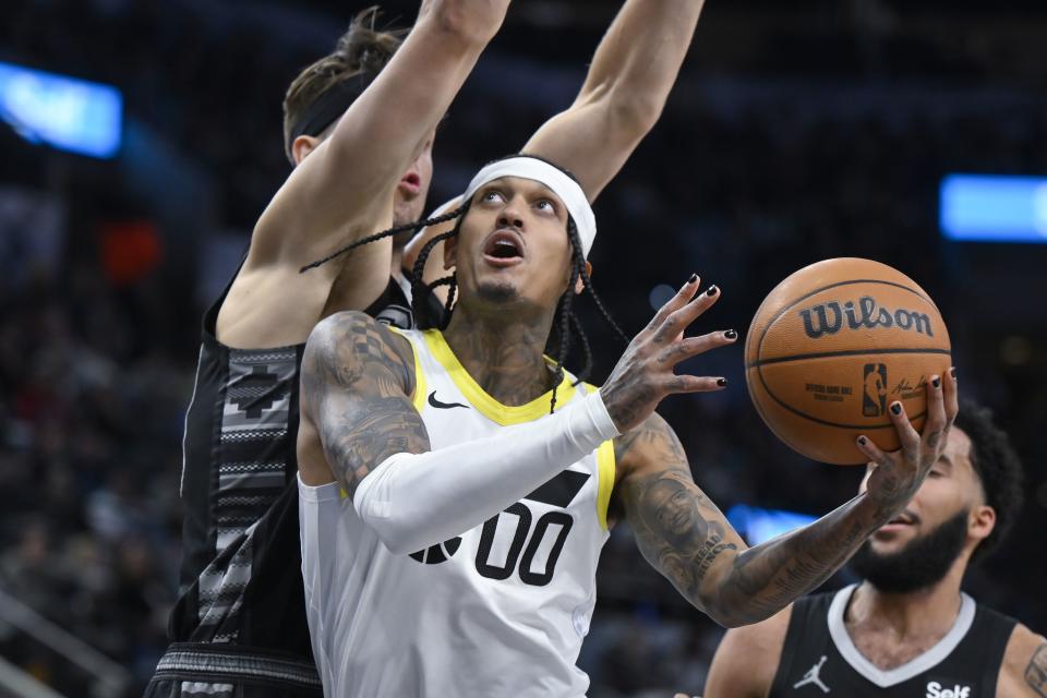 Utah Jazz’s Jordan Clarkson (00) goes to the basket against San Antonio Spurs’ Zach Collins, left, during the second half of an NBA basketball game Tuesday, Dec. 26, 2023, in San Antonio. | Darren Abate, Associated Press