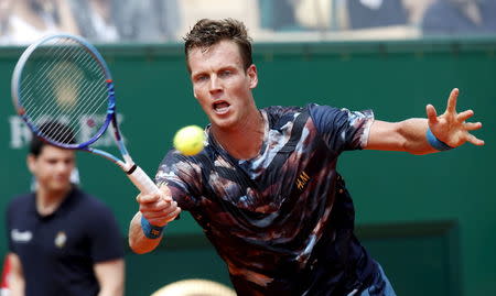 Tomas Berdych of the Czech Republic returns the ball to Gael Monfils of France during their men's singles semi-final tennis match at the Monte Carlo Masters in Monaco, April 18, 2015. REUTERS/Jean-Paul Pelissier