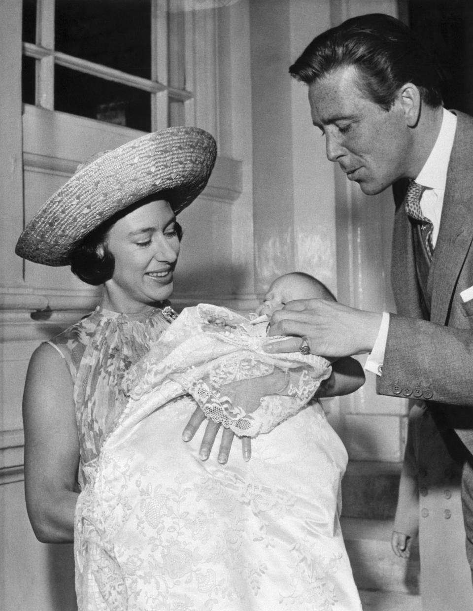 Princess Margaret and Antony Armstrong-Jones, the Earl of Snowdon, with their baby daughter, Lady Sarah Armstrong-Jones, on the day of her christening in 1964.