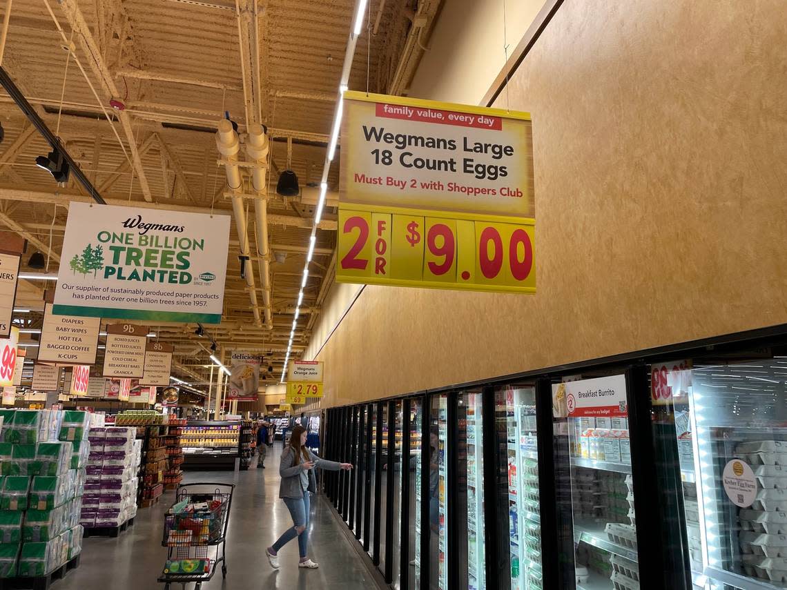 A sign advertises the price for a package of 3 dozen eggs at Wegmans grocery store in Raleigh, NC, on Jan. 12, 2023. The cost of eggs has increased dramatically in the U.S. because of a deadly outbreak of bird flu.