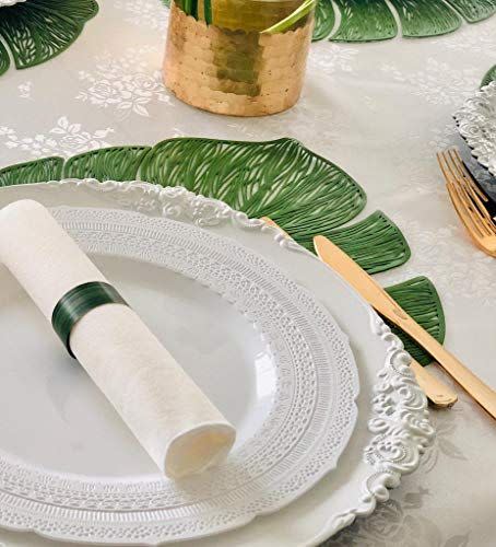 <p><strong>Occasions Finest Tableware</strong></p><p>amazon.com</p><p><strong>$25.90</strong></p><p><a href="https://www.amazon.com/dp/B07YG8TJYS?tag=syn-yahoo-20&ascsubtag=%5Bartid%7C2089.g.43326474%5Bsrc%7Cyahoo-us" rel="nofollow noopener" target="_blank" data-ylk="slk:Shop Now;elm:context_link;itc:0" class="link ">Shop Now</a></p><p>Bring the tropics to your backyard with this 10-piece set of leaf-shaped placemats. We have an inkling they’ll be the hit of your next al fresco gathering.</p>