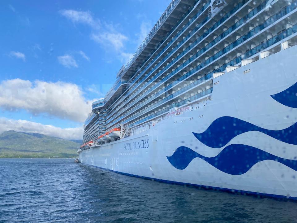 The exterior of a Princess cruise ship with the name Royal Princess.