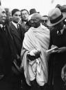 Gandhi with Reporters in Marseille (Photo by Hulton-Deutsch/Hulton-Deutsch Collection/Corbis via Getty Images)