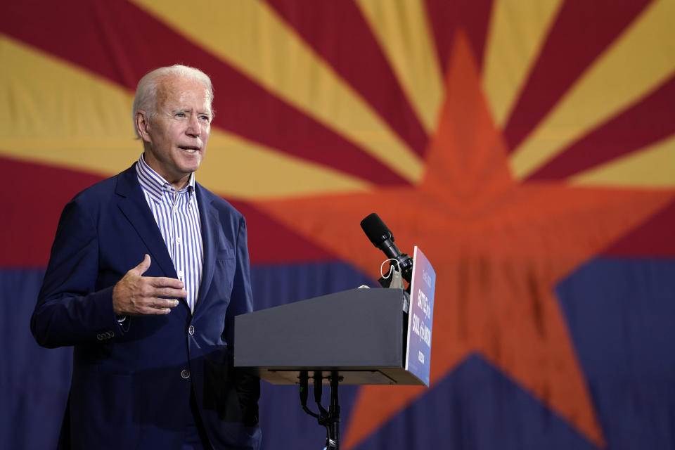 FILE - In this Oct. 8, 2020, file photo Democratic presidential candidate former Vice President Joe Biden speaks at the Carpenters Local Union 1912 in Phoenix. New census data that reassigned states’ votes in Electoral College didn’t upend Democrats’ or Republicans’ basic strategies for securing 270 votes needed to win the White House. But it hints at new paths not too far off. The 2020 census count will require a shift in congressional representation away from Rust Belt of the upper Midwest toward the southern Sun Belt. (AP Photo/Carolyn Kaster, File)