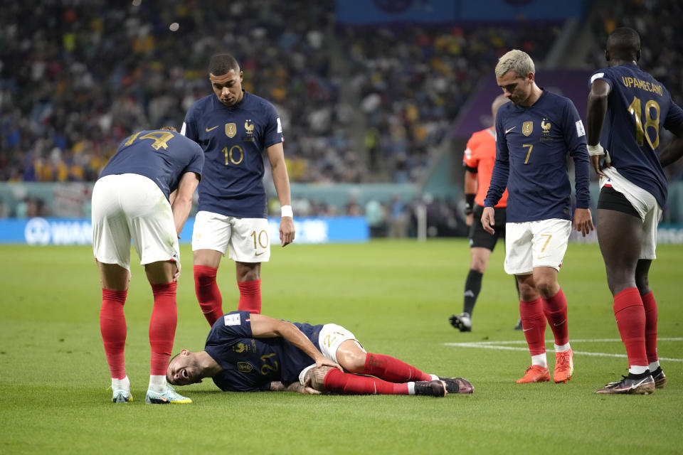 France's Lucas Hernandez is seen down injured during the World Cup group D soccer match between France and Australia, at the Al Janoub Stadium in Al Wakrah, Qatar, Tuesday, Nov. 22, 2022. (AP Photo/Christophe Ena)