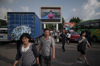 <p>In Pyongyang, a news bulletin on an outdoor television screen highlights the trip to Singapore by North Korean leader Kim Jong Un, but not his meeting with President Trump. (Photo: Ed Jones/AFP/Getty Images) </p>