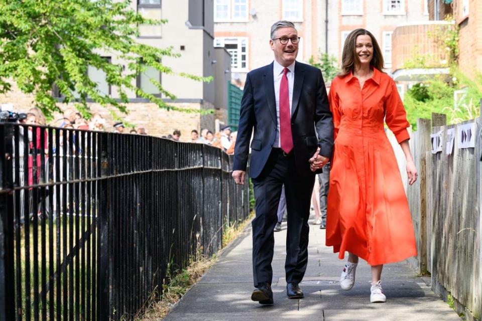 london, england july 04 leader of the labour party keir starmer walks with his wife victoria starmer, as they arrive at a polling station to place their votes in the 2024 general election on july 04, 2024 in london, england voters in 650 constituencies across the uk are electing members of parliament to the house of commons via the first past the post system rishi sunak announced the election on may 22, 2024 the last general election that took place in july was in 1945, following the second world war, which resulted in a landslide victory for clement attlees labour party photo by leon nealgetty images