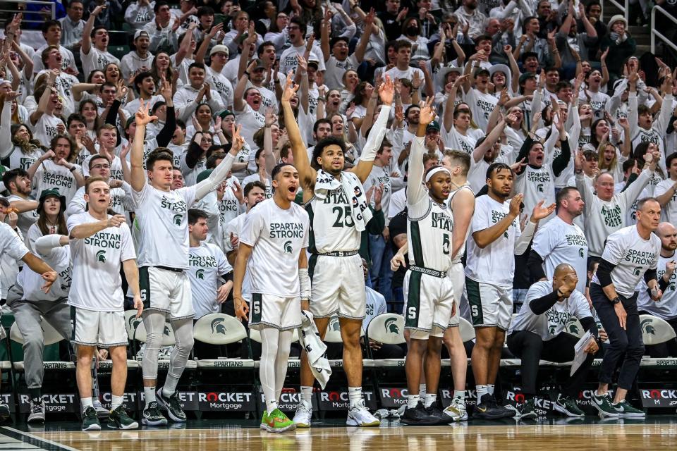 Michigan State's bench reacts after Jaden Akins makes a 3-pointer against Indiana.