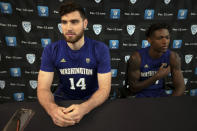 Washington's Sam Timmins, left, and Nahziah Carter speak during the Pac-12 NCAA college basketball media day, in San Francisco, Tuesday, Oct. 8, 2019. (AP Photo/D. Ross Cameron)