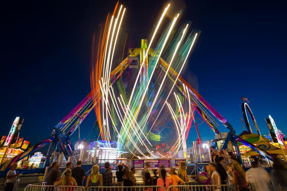 6/25/2018: Tribune File Photo/MICHAEL CATERINA
The St. Joseph County 4-H Fair takes place Friday through July 8 at the St.Joseph County 4-H Fairgrounds in South Bend. 

Rides spin near the midway after dark at the St. Joseph County 4-H Fair in South Bend Tuesday, June 5, 2016. Tribune Photo/MICHAEL CATERINA