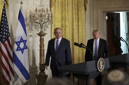 U.S. President Donald Trump (R) and Israeli Prime Minister Benjamin Netanyahu arrive for a joint news conference at the White House in Washington, U.S., February 15, 2017. REUTERS/Carlos Barria